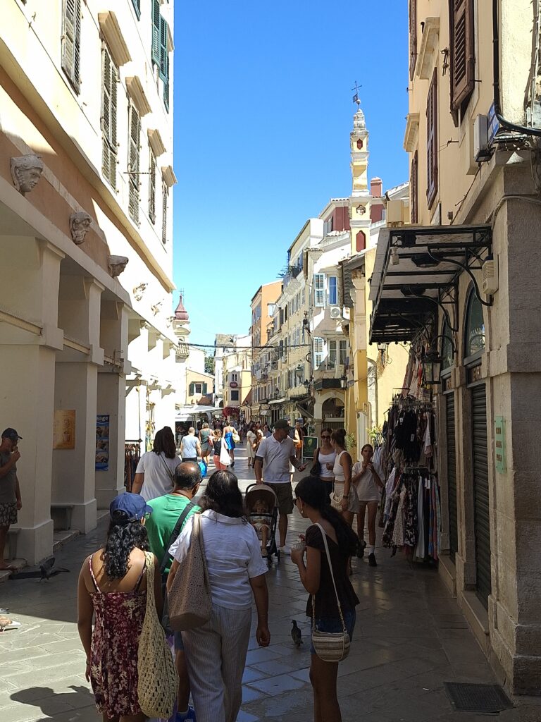 People walking through the historic streets of Corfu Old Town